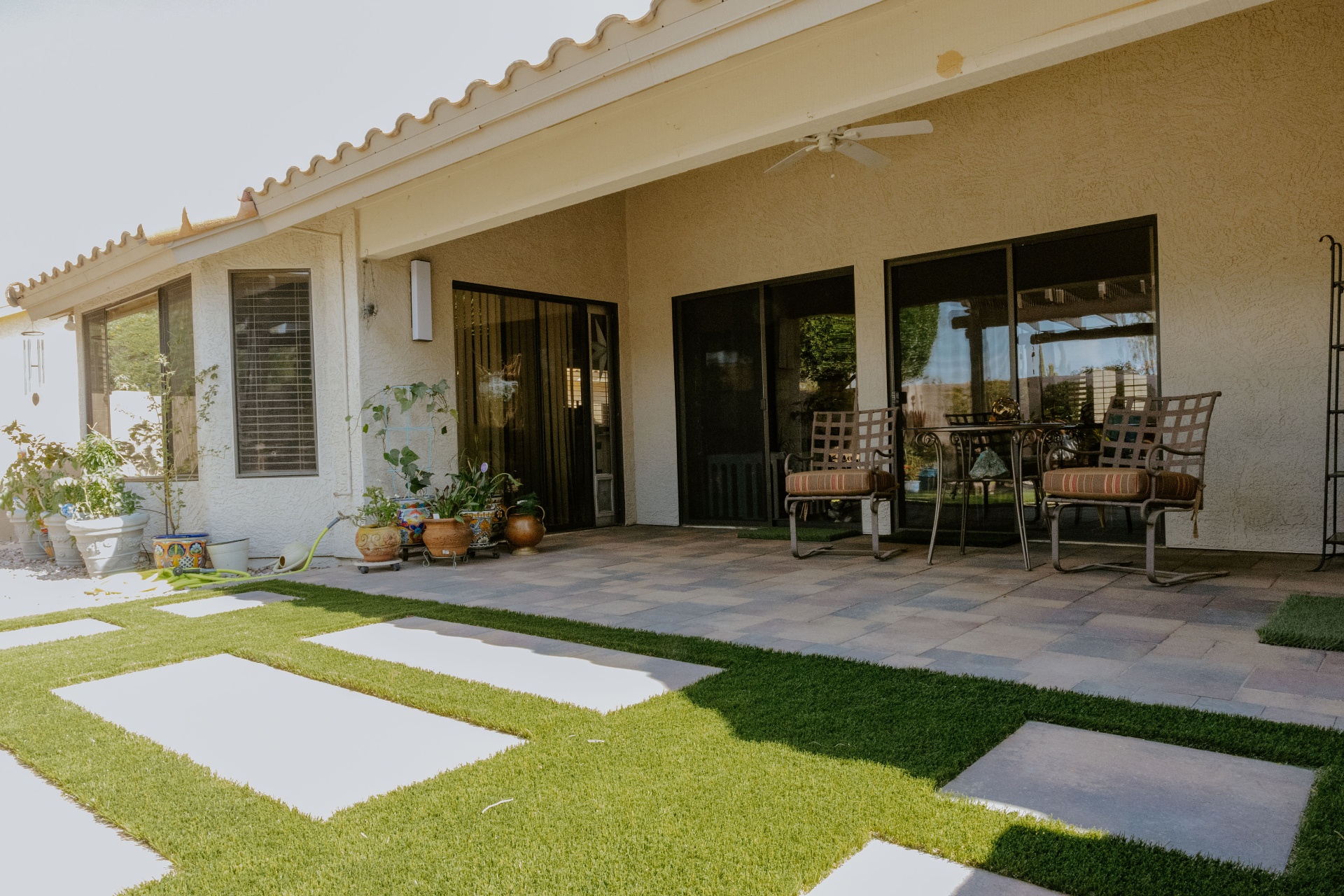 Covered Patio · Turf & Pavers after